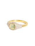 Gold ring with a green gemstone on a white background
