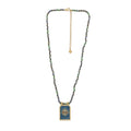 Necklace with a rectangular pendant on a white background.