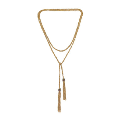 Gold necklace with tassels on a white background