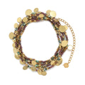 Beaded neclaces with tourmaline with gold charms on a white background